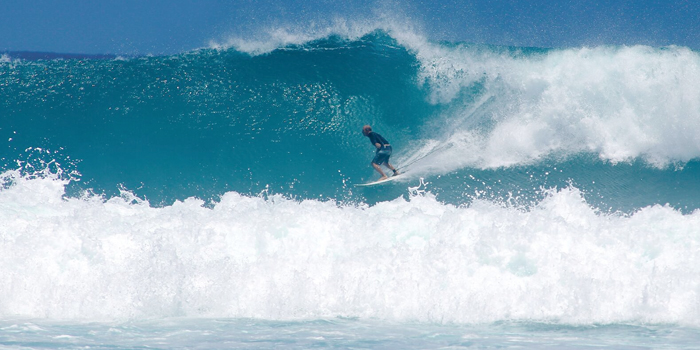 Jim Tolliver charges down a beautiful water wall From resplendent oceanfront sceneries to ancient ruins Aguadilla presents a unique experience to surfers as well as nature and wildlife enthusiasts on a global scal